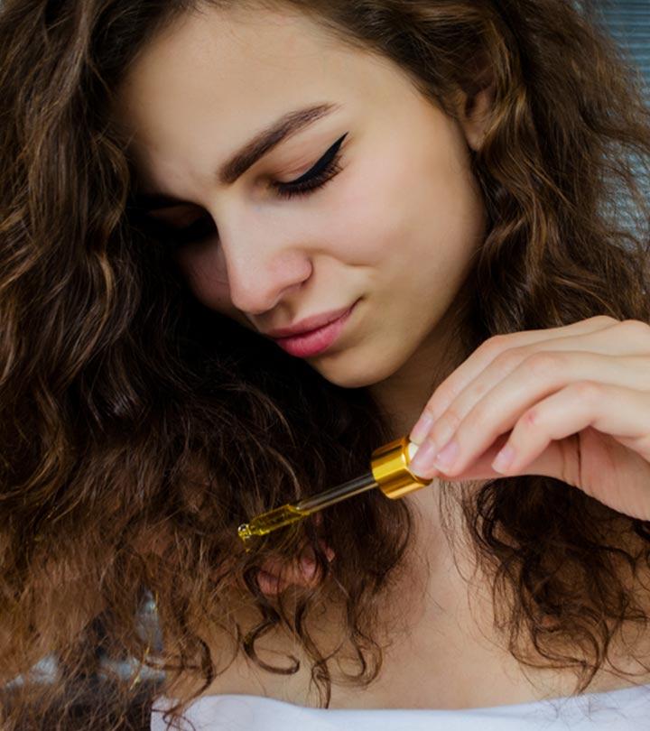 A Women Using  Hair Serum On Hair