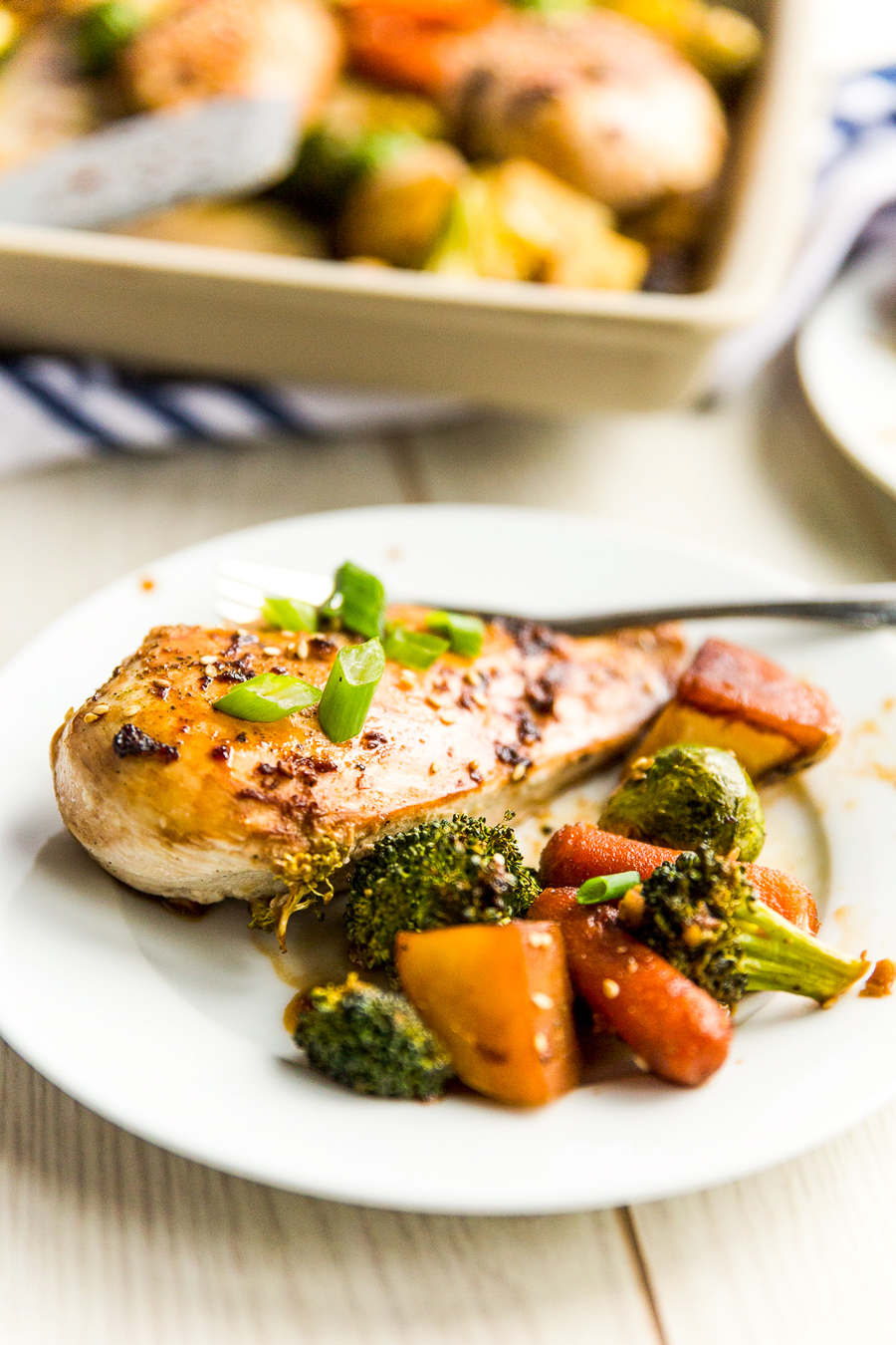 This Honey Ginger Chicken Sheet Pan Dinner is an easy Asian-inspired dish made with a tangy homemade sauce. You only need one pan to make it, so cleanup is a breeze!