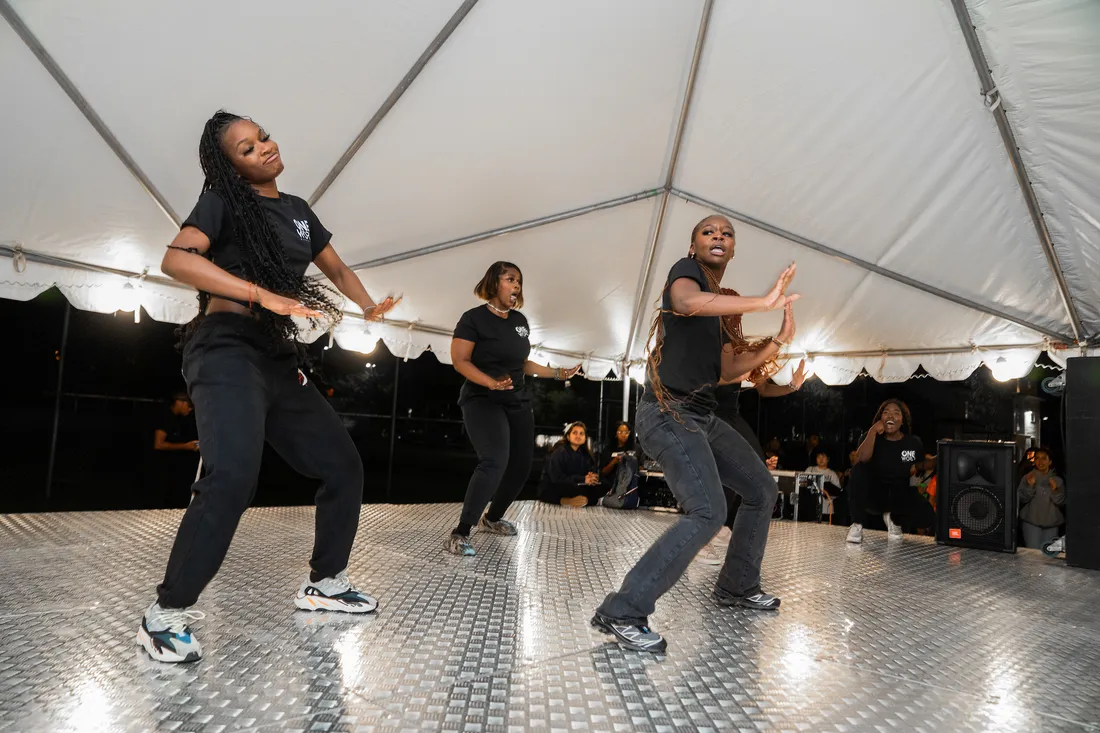 People dancing on stage.