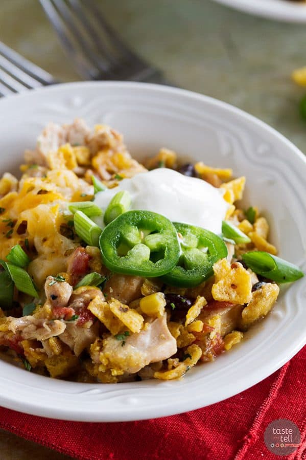 Look no further for an easy slow cooker dinner recipe! This Slow Cooker Cheesy Chicken and Frito Casserole comes together quickly and you can never go wrong when there are Fritos involved!