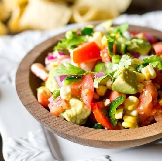 Corn, Tomato and Avocado Salad makes the ideal summer side dish to take advantage of the fresh garden produce. Serve with tortilla chips as a dip, too! Sugar free, light and healthy.