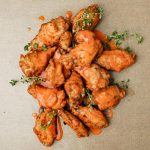 buffalo chicken wings on parchment paper