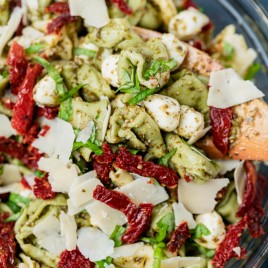 closeup of a bowl of pesto tortellini pasta salad