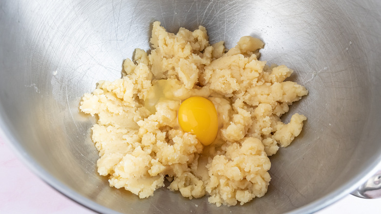 adding eggs to choux pastry