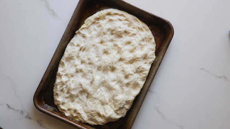 Focaccia dough on tray