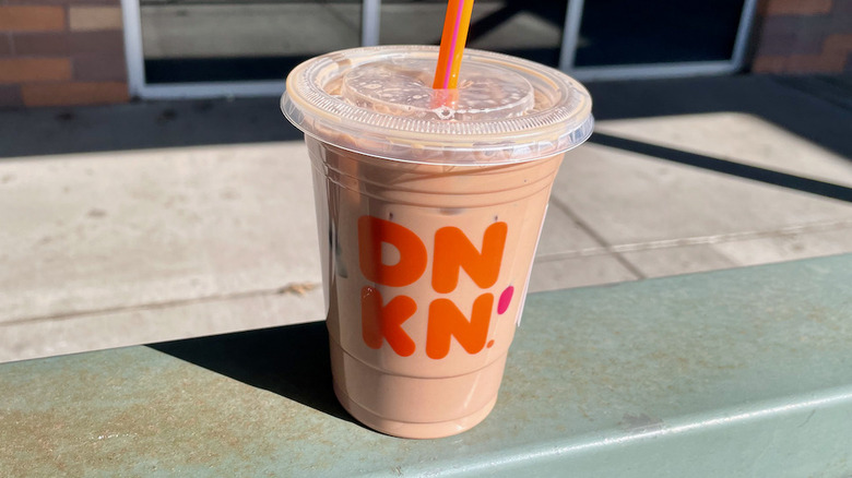 Iced latte on metal railing