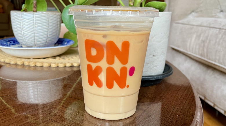 Dunkin' iced macchiato with houseplant