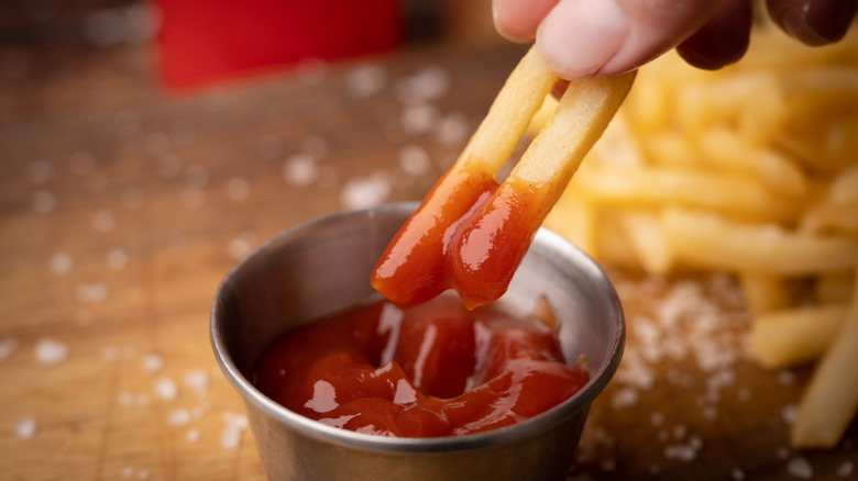 dipping fries in ketchup