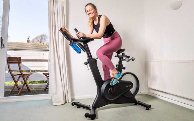 Maddi Howell on the Apex exercise bike