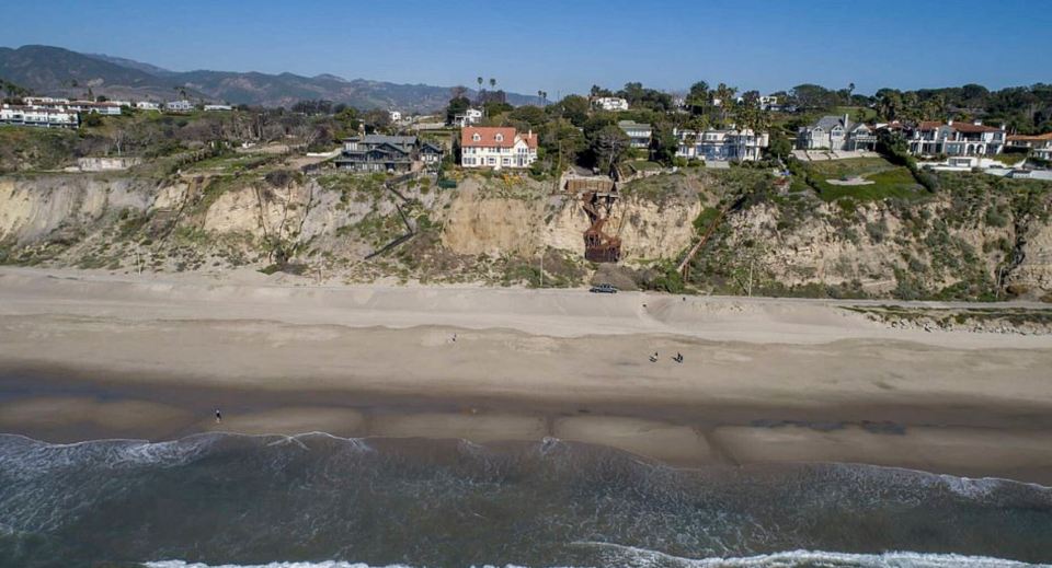  The gated home sits comfortably atop the famous Californian cliff