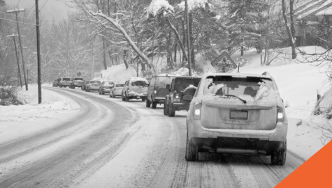 The Ultimate Guide To Winter Driving | suv driving along snowy road with snow covered trees | Billyard Insurance Group blog