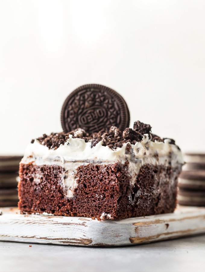 oreo poke cake slice showing the pokes in the cake