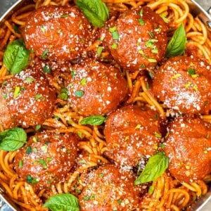 meatballs over pasta in pan