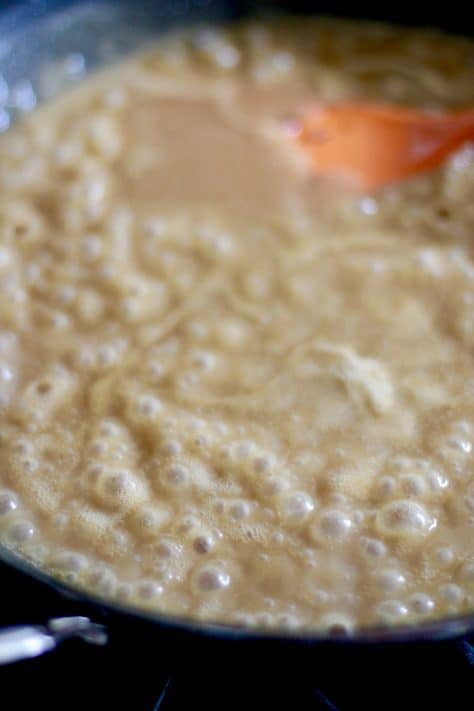 beef broth added to roux, heat turned to high to thicken