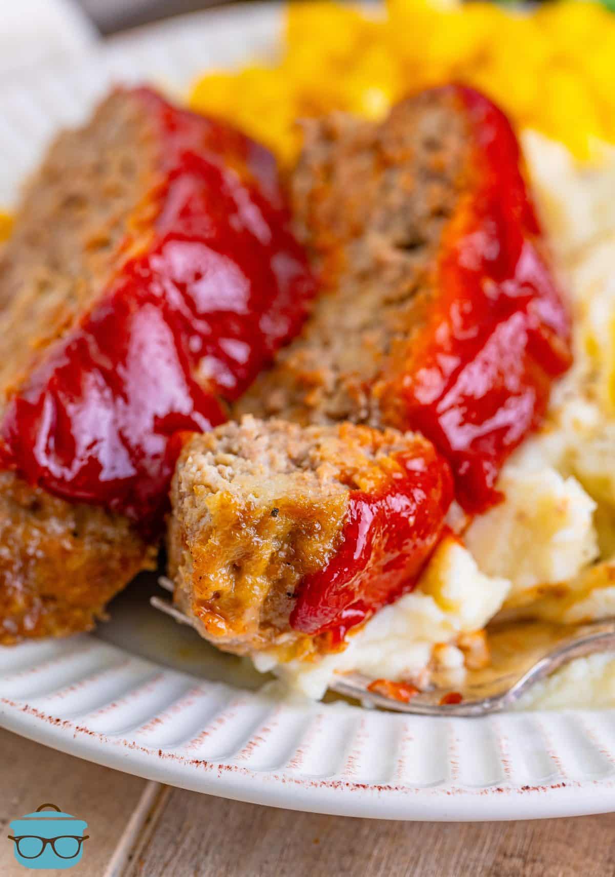 A few slices of Momma's Meatloaf on a plate.