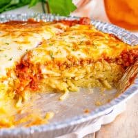 Closely looking at Spaghetti Pie on a pie plate.