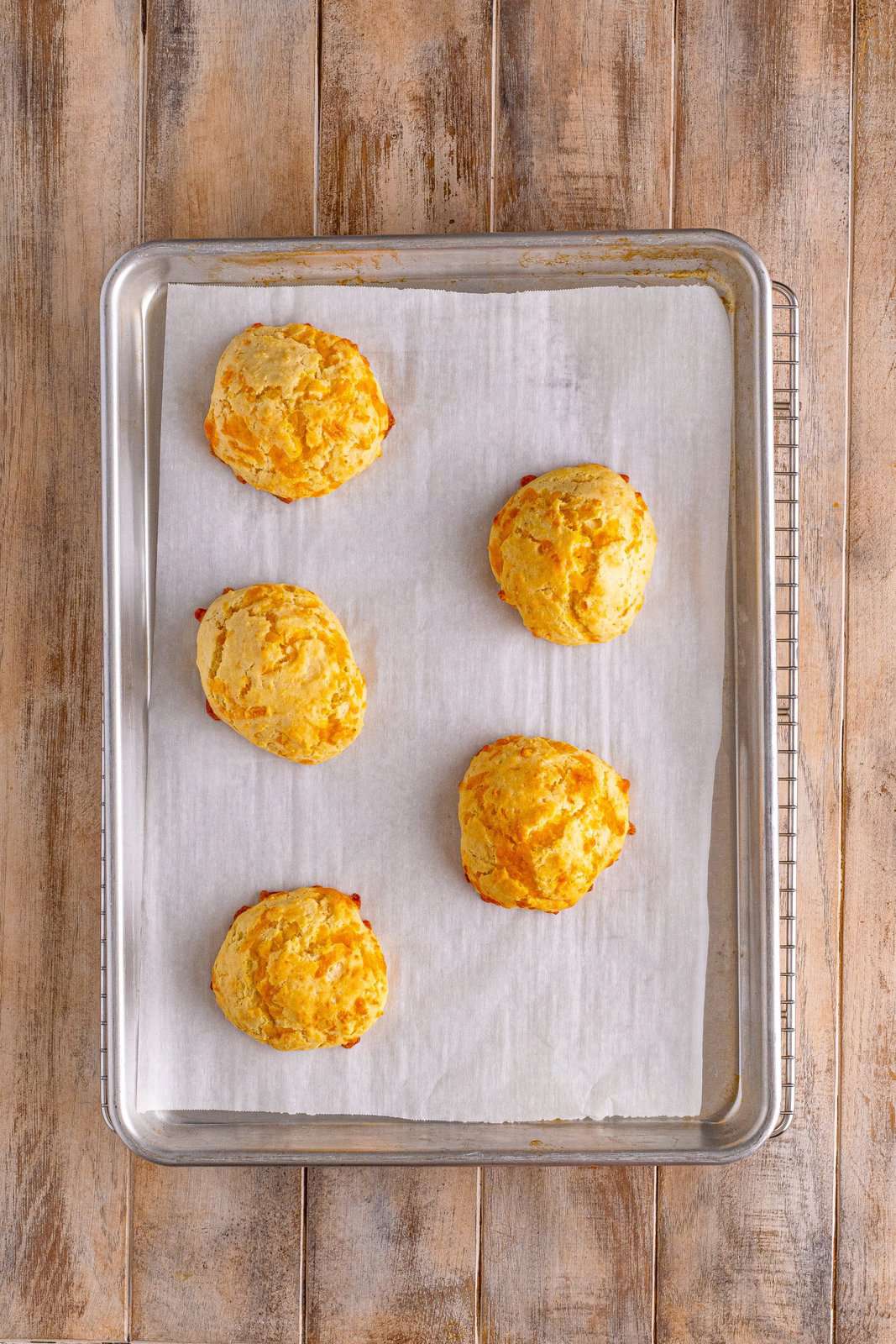 A baking sheet with baked biscuits.