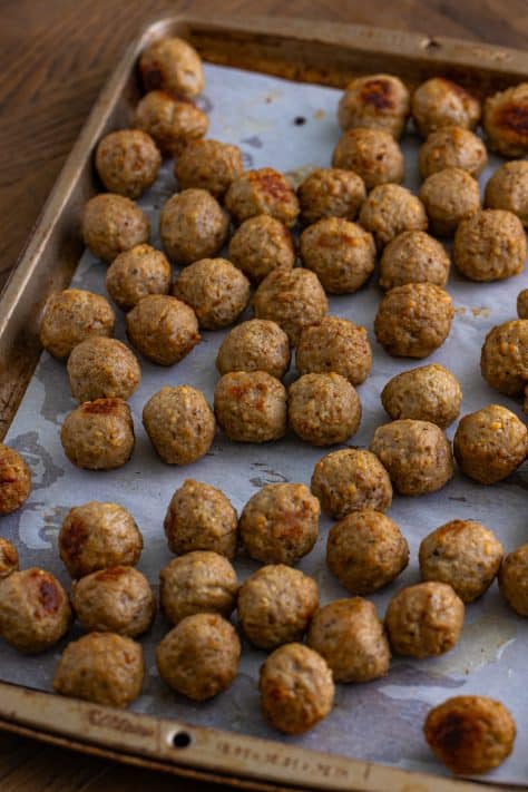 Cooked meatballs on a tray.