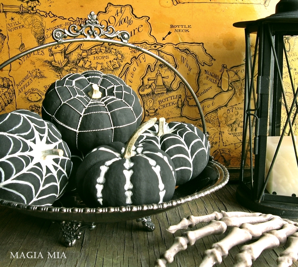 black and white spooky painted pumpkins