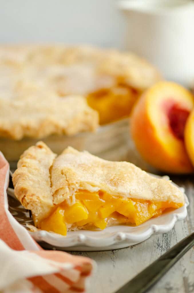 slice of peach pie on plate