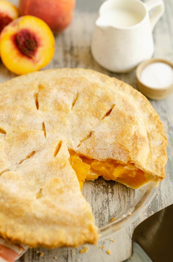 peach pie with slice removed