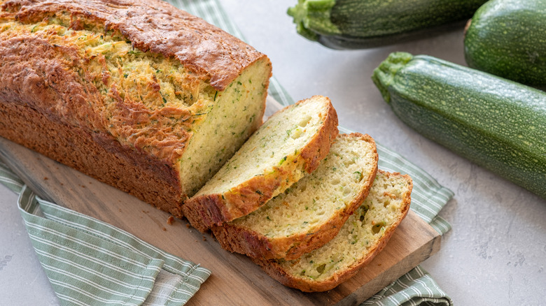 Sliced zucchini bread on board