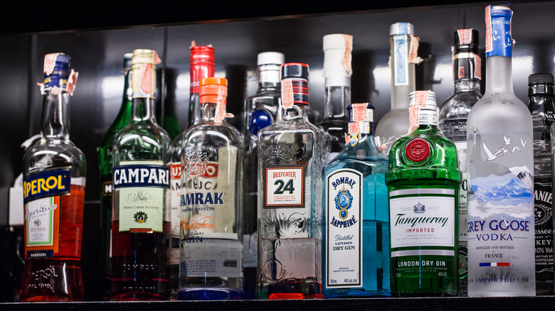 A full row row of various liquor bottles