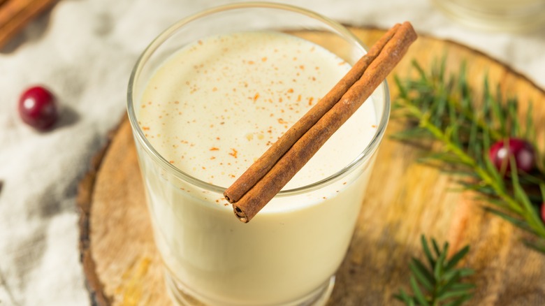 A glass of eggnog resting on a table