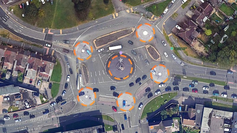 Top-down image of The Magic Roundabout in Swindon, England with each of the six roundabouts highlighted for visibility.