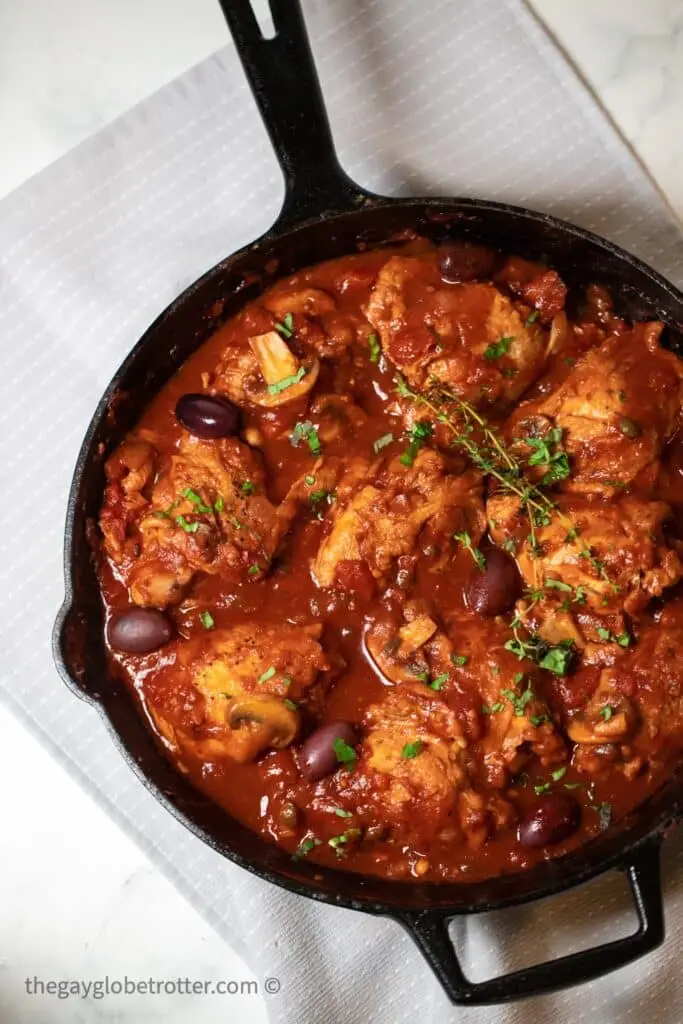 Chicken cacciatore being simmered with thyme.