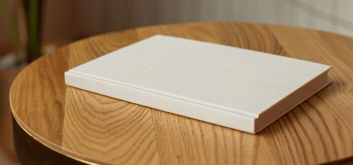 White book in top of brown table