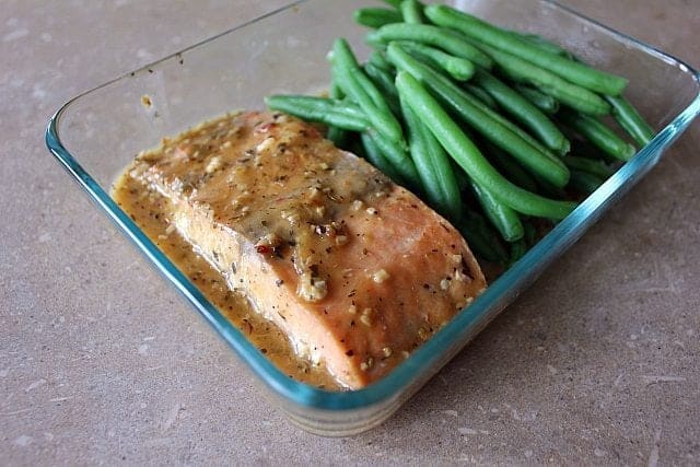 Close up of Salmon & Green Beans in a glass container