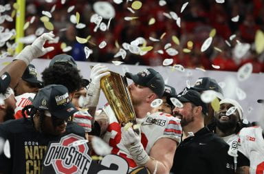 Ohio State senior defensive end Jack Sawyer (33) kisses the College Football Playoff National Championship trophy after the Buckeyes defeated Notre Dame 34-23 Monday at Mercedes-Benz Stadium in Atlanta. Credit: Carly Damon | Asst. Photo Editor