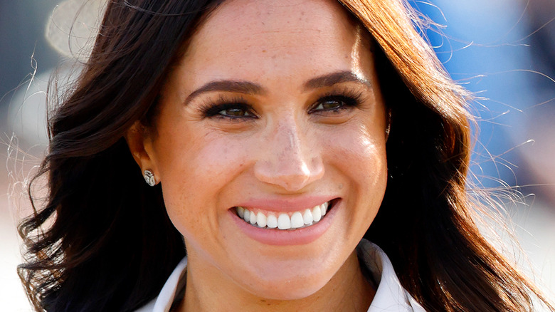 Meghan Markle smiling for photo