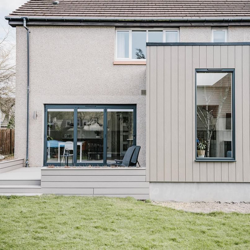 ash white composite decking boards also used to clad the house