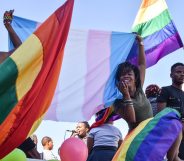 Dozens of people cheer and dance as they take part in the Namibian Lesbians, Gay, Bisexual and Transexual (LGBT) community pride Parade in the streets of the Namibian Capitol on July 29, 2017 in Windhoek. Even though there have been marches and protests against discrimination against the LGBT community in the past years, this is the first time that the community held such a parade along the capital's main street, Independence Avenue, to celebrate their identity and rights. / AFP PHOTO / Hildegard Titus (Photo credit should read HILDEGARD TITUS/AFP/Getty Images)