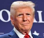 US President Donald Trump looks on after delivering remarks at the House Republican Members Conference Dinner at Trump National Doral Miami, in Miami, Florida.