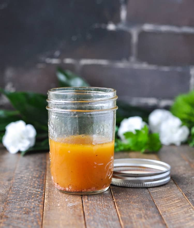 Homemade red wine vinaigrette salad dressing in a jar for tuna nicoise salad