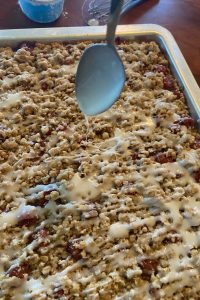 Glazed Oatmeal Cherry Bars recipe is easy to make for a perfect dessert choice. Using cherry pie filling, these dessert bars feature a buttery brown sugar and oatmeal crust and topping.  Cherry Bars with cherry pie filling are great to feed a crowd.