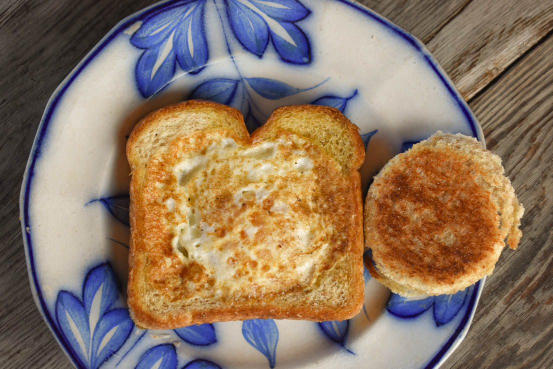 Egg in a Basket is a simple, yet delicious breakfast dish that you can have on the table in less than 10 minutes. A variation of the classic British dish - toad in the hole - this one features just toast and a runny fried egg.