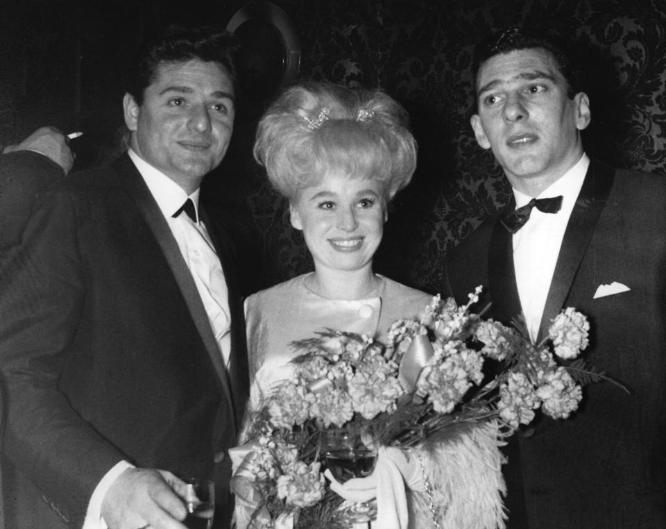  Reggie Kray, right, at a film premiere with actress Barbara Windsor and her husband Ronnie Knight