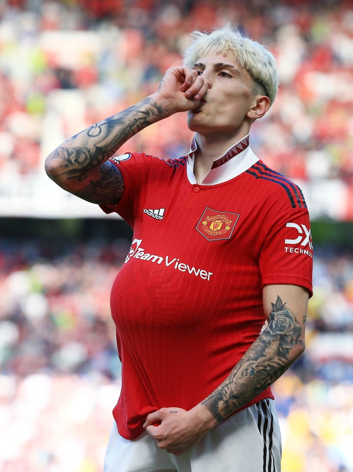 Alejandro Garnacho sticks the ball under his shirt after scoring for Manchester United against Wolves