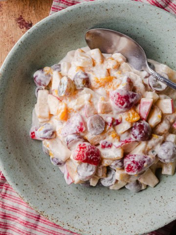 Fruit salad made with condenses milk.