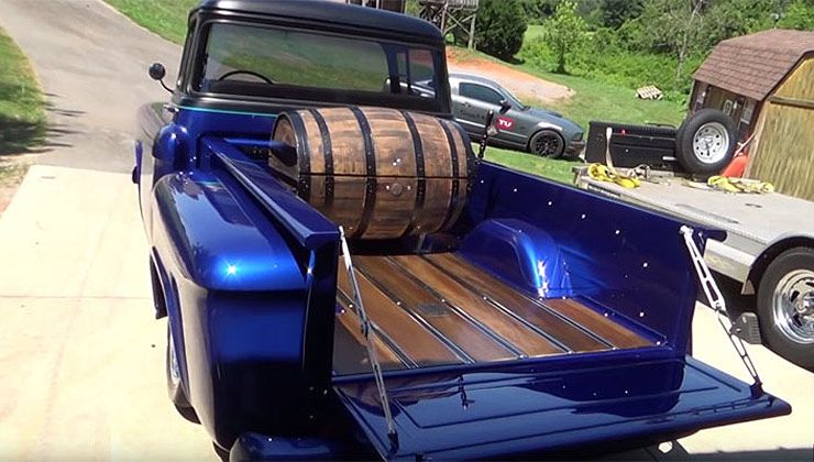 1955 Chevrolet Street truck with a whiskey barrel in its bed