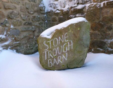 Hand carved lettering on house name stone