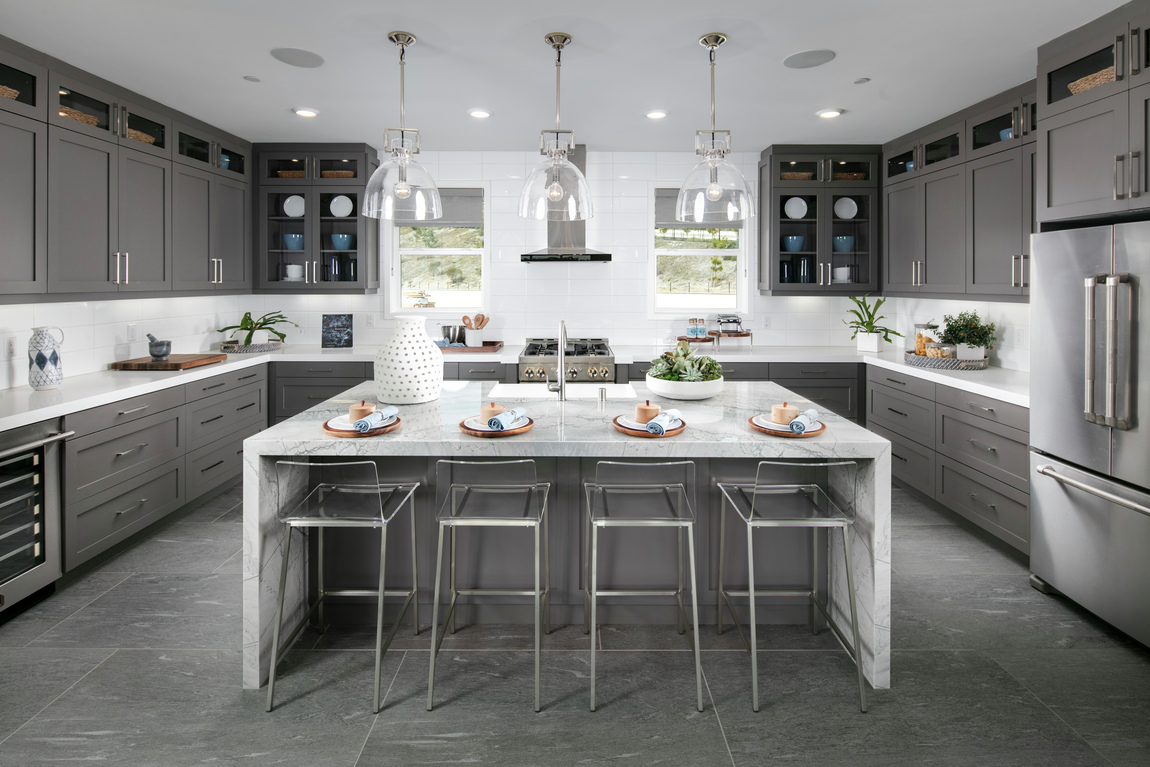 A luxury kitchen with seating for four at the large kitchen island.