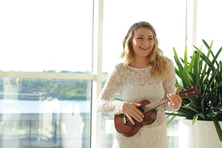 Girl playing on a ukulele