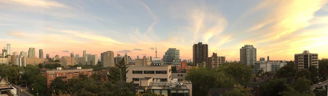 Photo by Claus Rinner showing Toronto skyline with evening colours