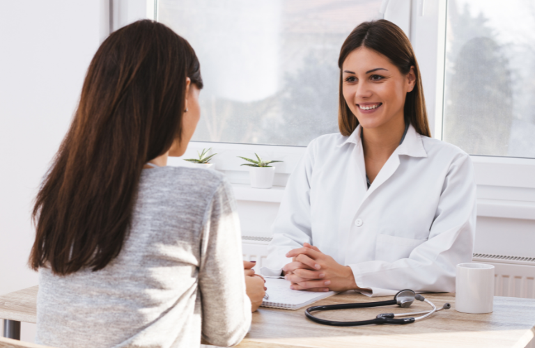 Woman consulting doctor about health concerns