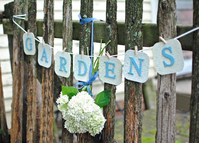 DIY Garden Banner on Rustic Fence